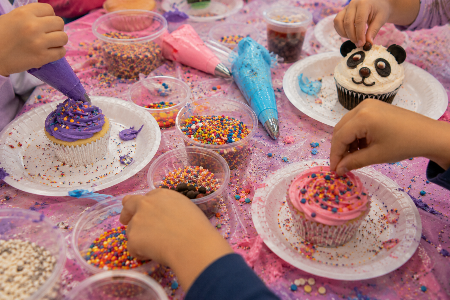 Close-up of colorful cupcake decorating supplies and sprinkles
